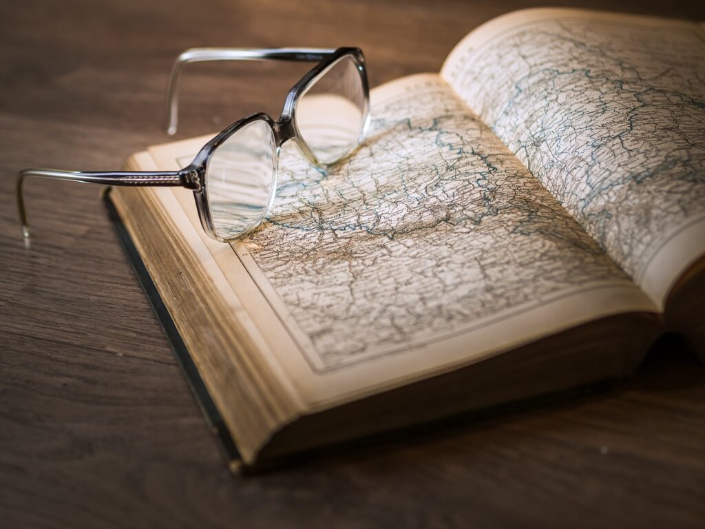 glasses on an old textbook,Taming of the antithesis proposition